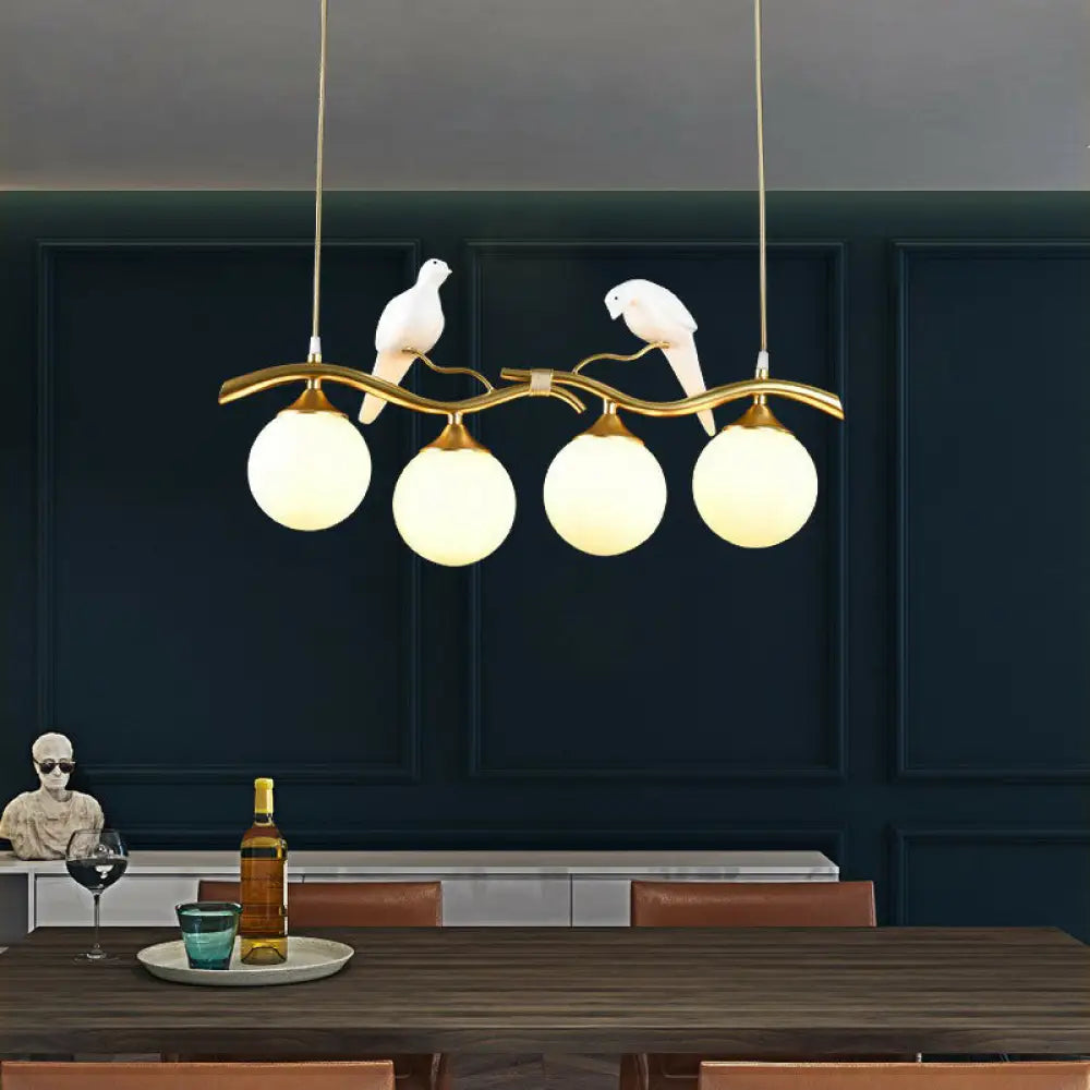 Modern Branch Island Pendant Light With Ball Glass Shade And Bird Deco - Metal 4-Light Fixture For