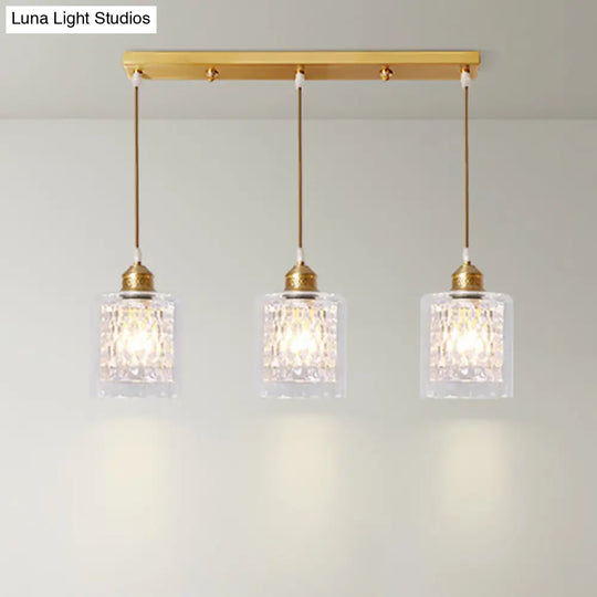 Modern Brass Cylinder Pendant Light With Prismatic Glass Shade - 3 Lights Linear/Round Canopy