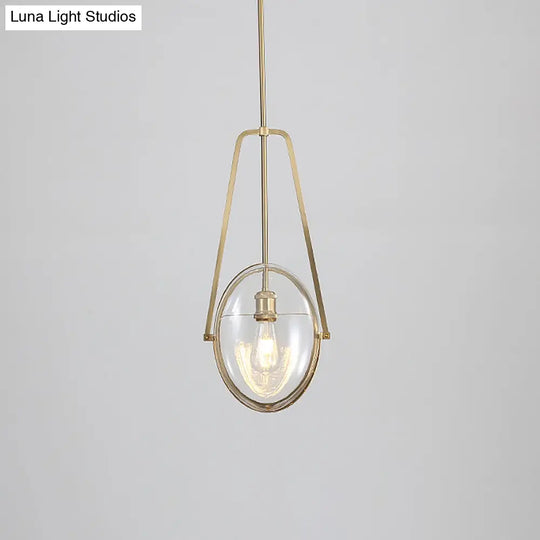 Modern Brass Pendant Light With Clear Glass Shade And Unique Halberd Frame