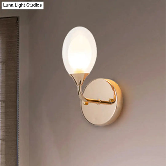 Modern Brass Wall Sconce With Clear Glass Shade - Oval Design For Dining Room