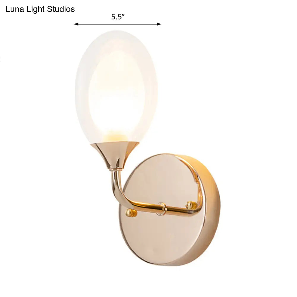 Modern Brass Wall Sconce With Clear Glass Shade - Oval Design For Dining Room