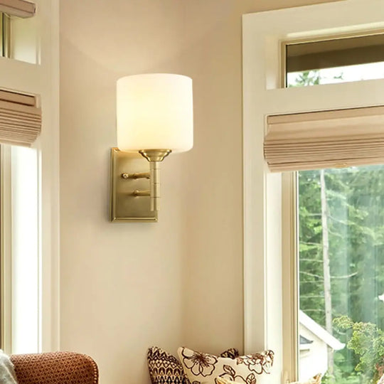 Modern Brass Wall Sconce With Cream Glass Drum Shade - Perfect Lighting For Living Room