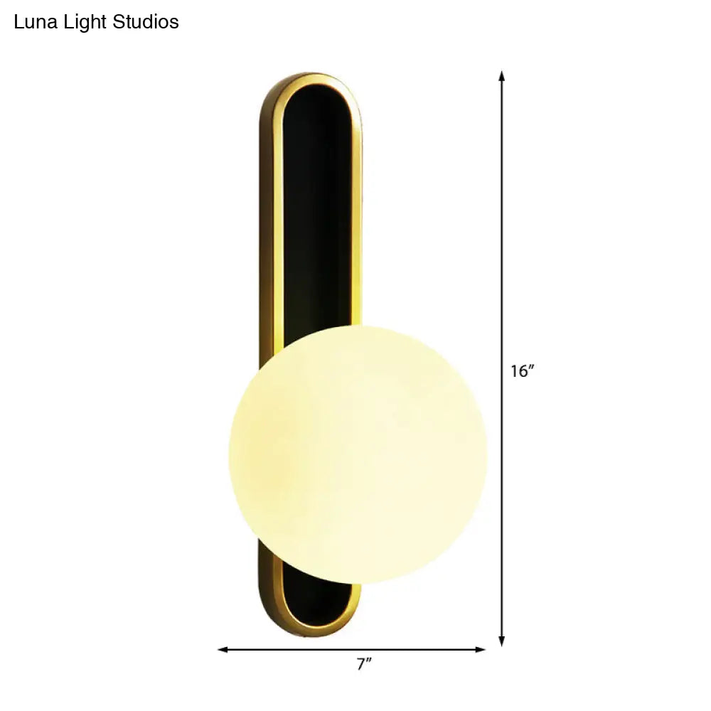 Modern Clear/Cream Glass Orb Wall Light With Brass Mount