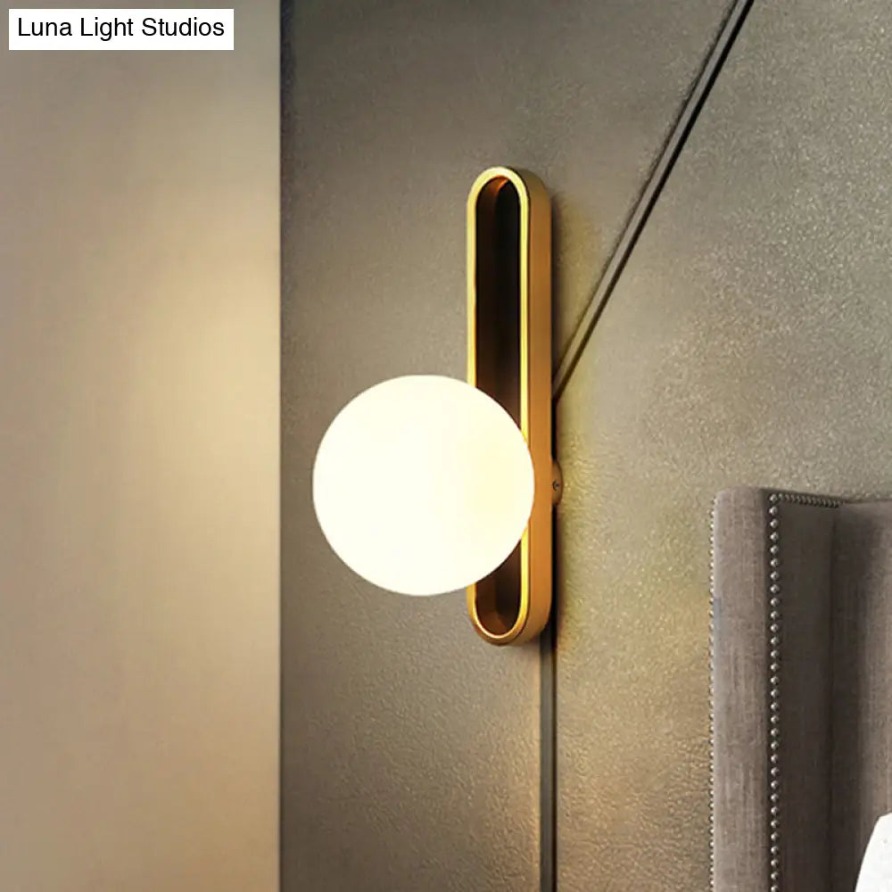 Modern Clear/Cream Glass Orb Wall Light With Brass Mount