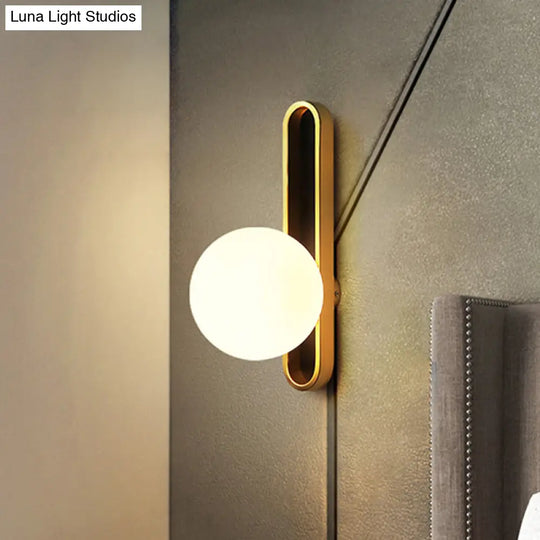 Modern Clear/Cream Glass Orb Wall Light With Brass Mount