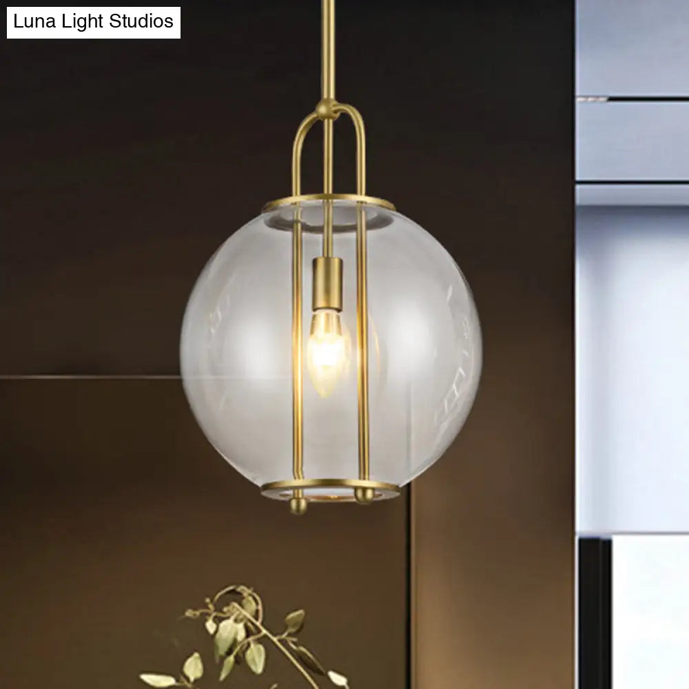 Clear Glass Hanging Lamp With Postmodern Globe Design - 1-Light Pendant In Brass For Bedside