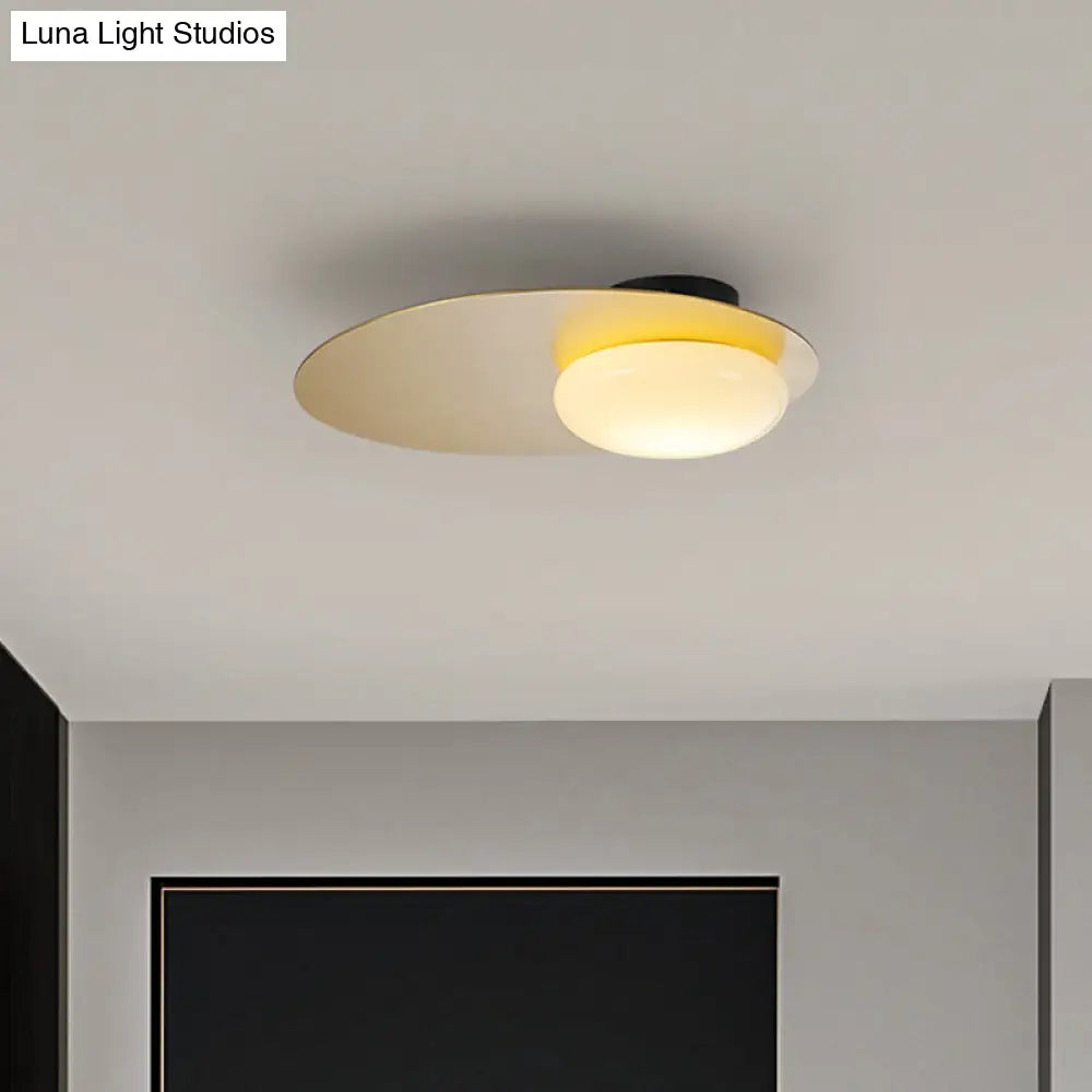 Modern Cream Glass Flush Mount Lamp: Designer 1-Light Ceiling Fixture With Black/Brass Disk Top