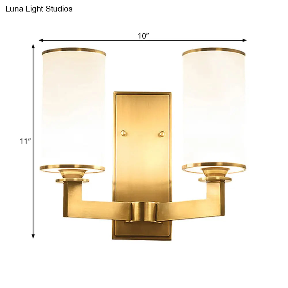 Modern Cylinder Wall Lamp 1/2-Head Frosted Glass Fixture In Brass For Living Room - Modernism Style