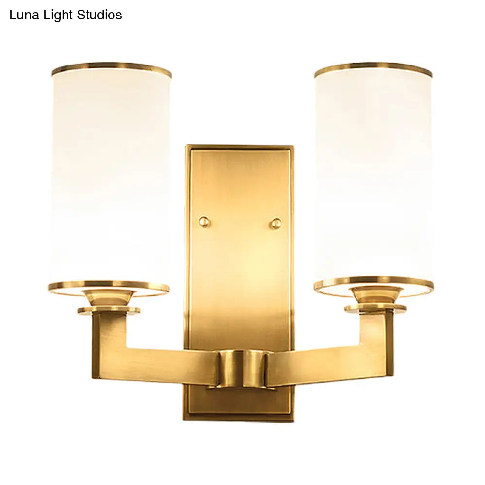 Modern Cylinder Wall Lamp 1/2-Head Frosted Glass Fixture In Brass For Living Room - Modernism Style