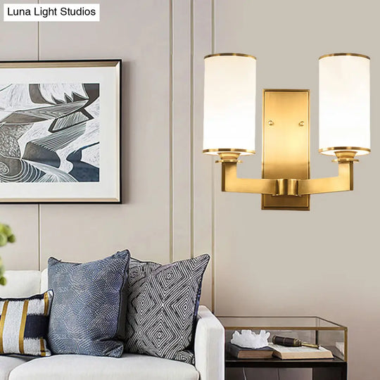 Modern Cylinder Wall Lamp 1/2-Head Frosted Glass Fixture In Brass For Living Room - Modernism Style