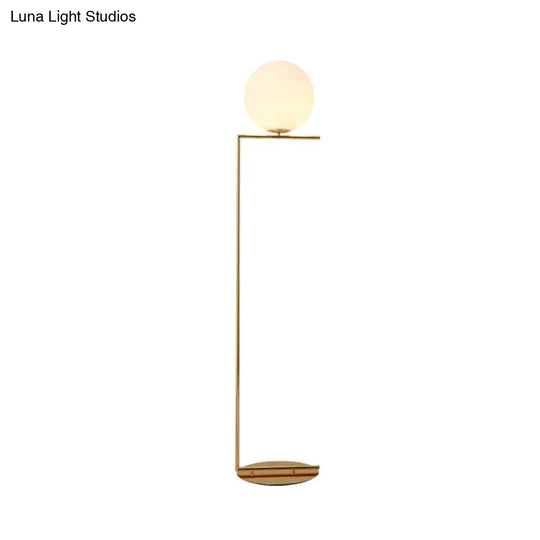 Modern Frosted Glass Spherical Floor Lamp With Gold Finish And Right Angle Arm