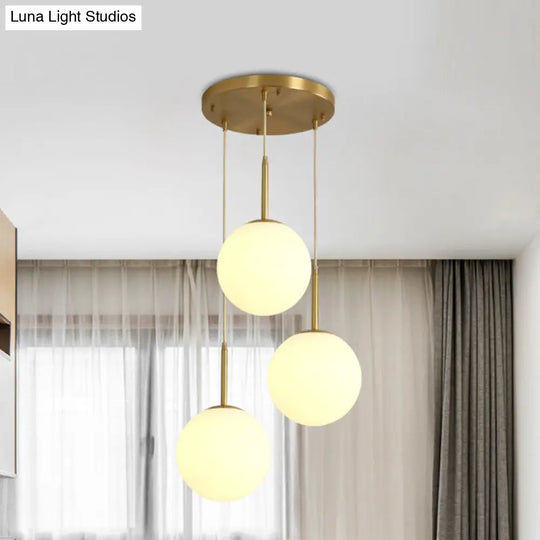 Modern White Glass Orb Hanging Ceiling Light With 3 Lights And Brass Finish