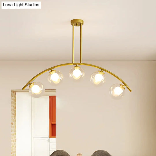 Modern Glass Orb Island Pendant Light With Brass Arch Arm - 5 Bulbs White/Clear Design For Dining