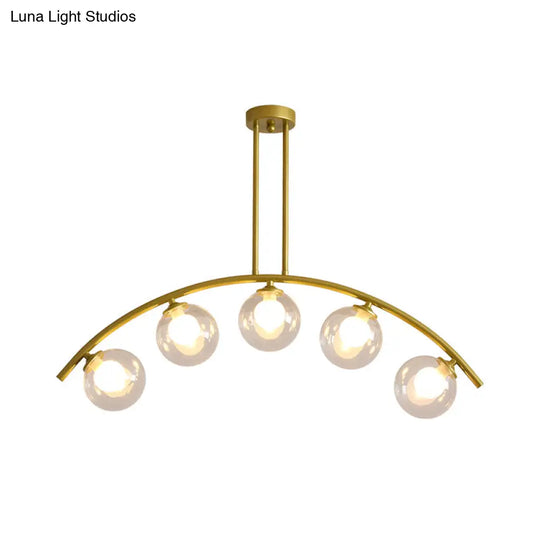 Modern Glass Orb Island Pendant Light With Brass Arch Arm - 5 Bulbs White/Clear Design For Dining