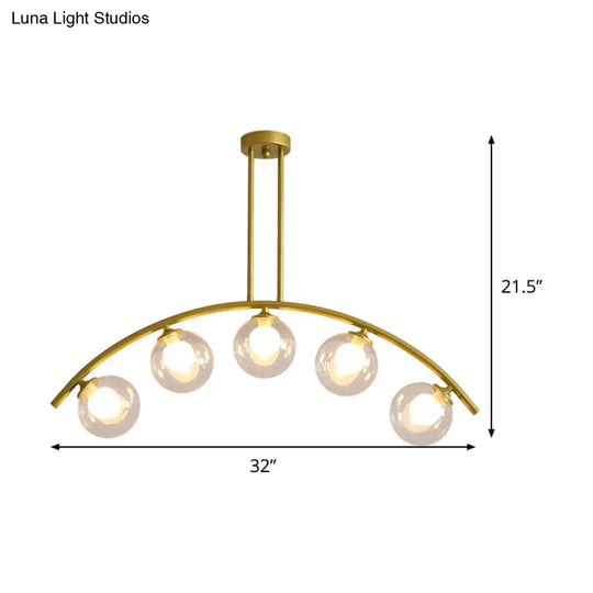 Modern Glass Orb Island Pendant Light With Brass Arch Arm - 5 Bulbs White/Clear Design For Dining