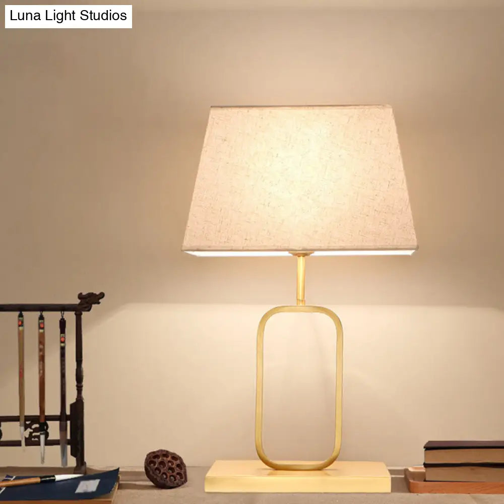 Modern Gold Bedside Table Lamp With Rounded Rectangle Shape And Fabric Shade