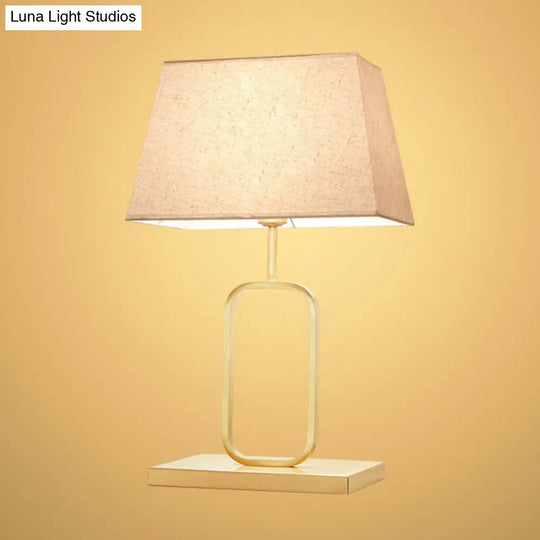 Modern Gold Bedside Table Lamp With Rounded Rectangle Shape And Fabric Shade