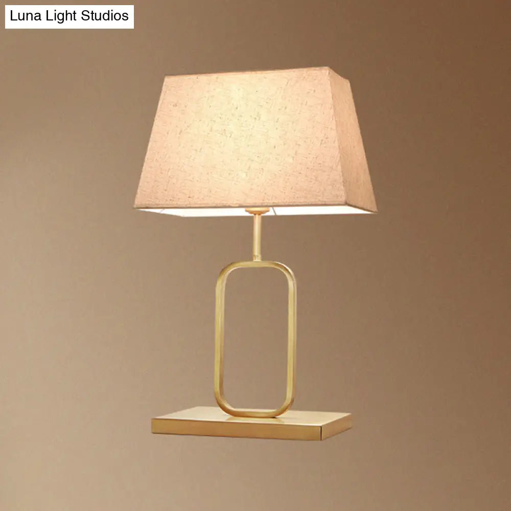 Modern Gold Bedside Table Lamp With Rounded Rectangle Shape And Fabric Shade