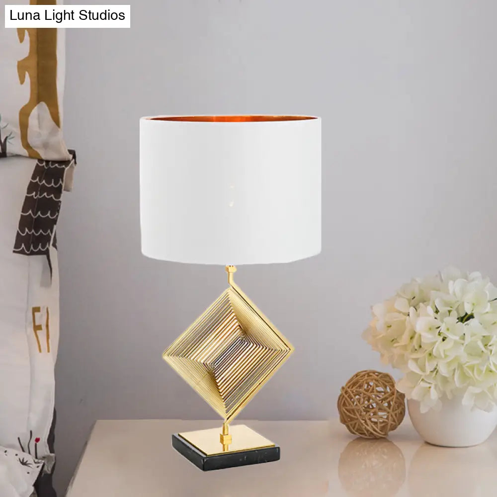 Modern Gold Metal Pyramid Bedside Lamp With White Fabric Shade