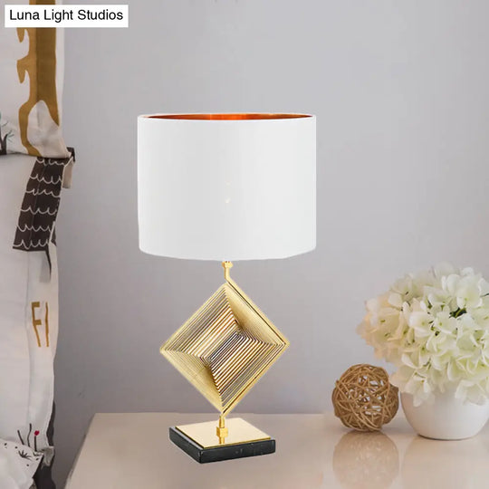 Modern Gold Metal Pyramid Bedside Lamp With White Fabric Shade