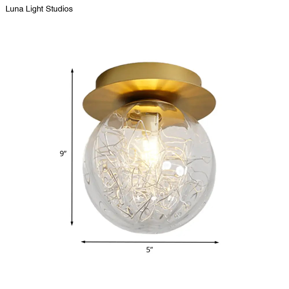 Modern Gold Pumpkin Ball Flush Light Fixture With Clear Glass Shade And Metal Line Inside