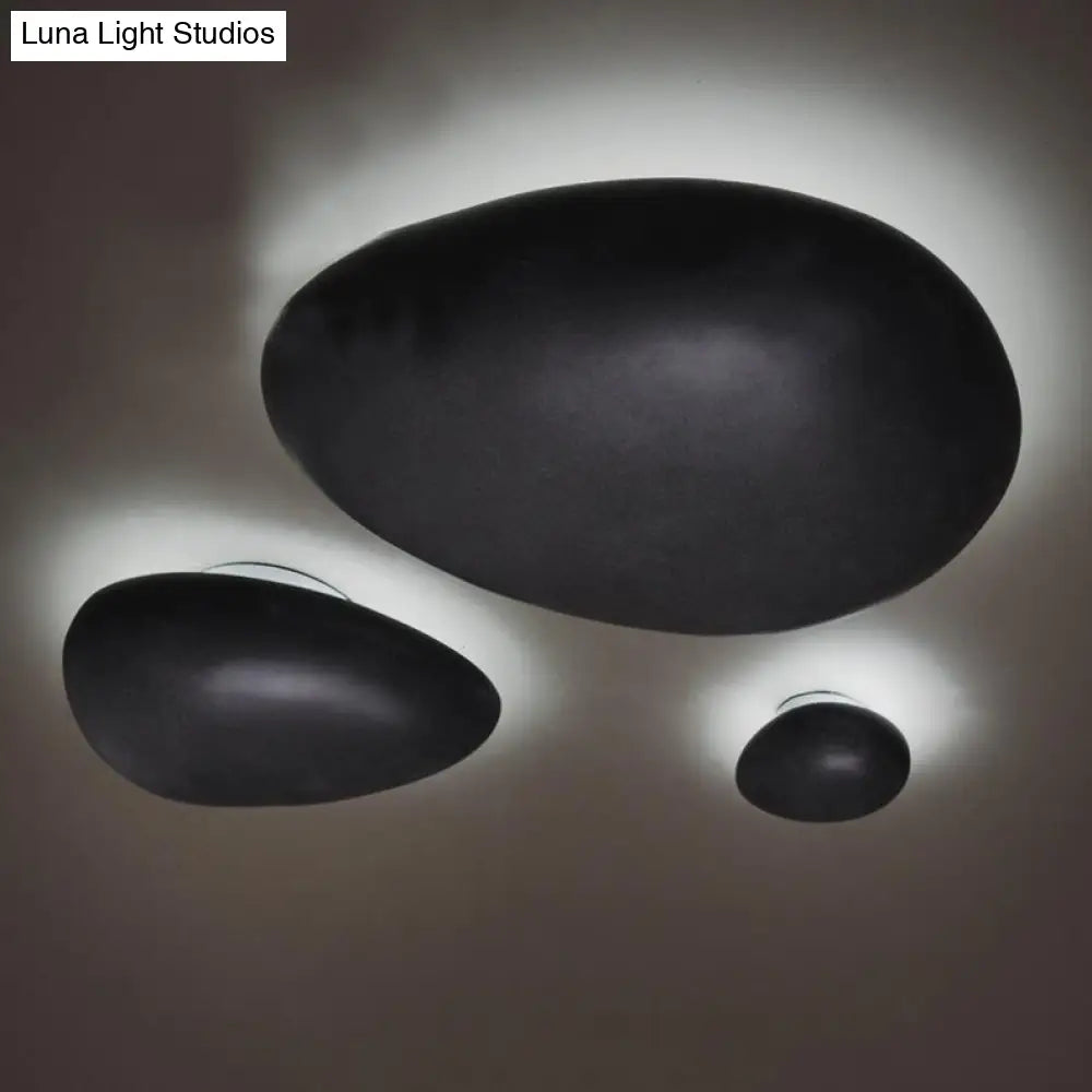 Modern Led Wall Lamp - Pebble Shape Resin Sconce Light Fixture (4/9 Length) In Black