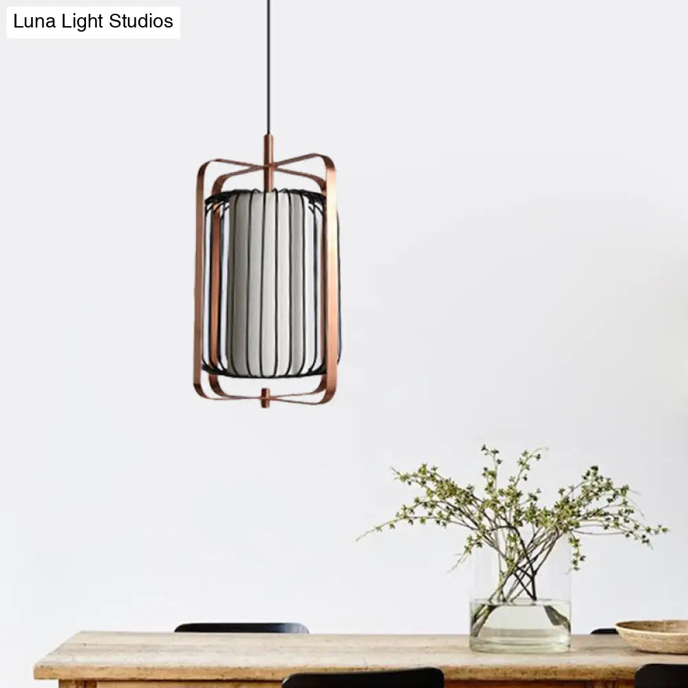 Modernist Metal 1-Light Rose Gold Pendant With Black Cage And White Fabric Shade