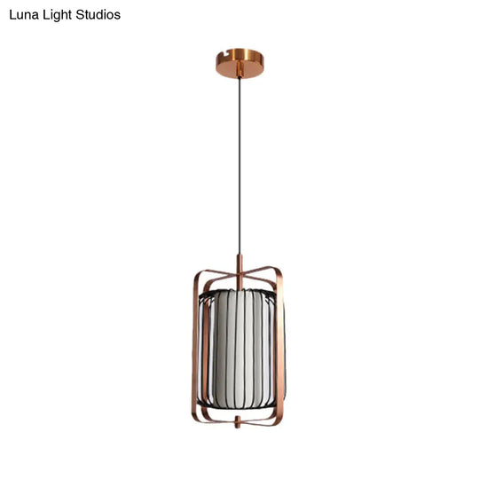 Modernist Metal 1-Light Rose Gold Pendant With Black Cage And White Fabric Shade