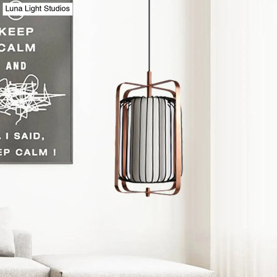 Modernist Metal 1-Light Rose Gold Pendant With Black Cage And White Fabric Shade