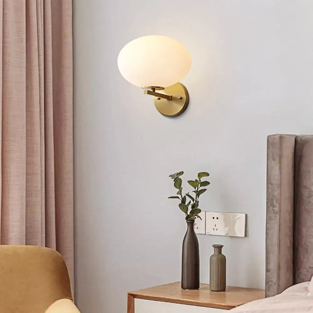 Modern Milk Glass Wall Sconce With Brass Finish