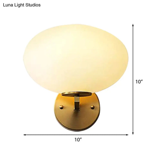 Modern Milk Glass Wall Sconce With Brass Finish