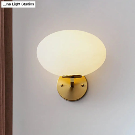 Modern Milk Glass Wall Sconce With Brass Finish