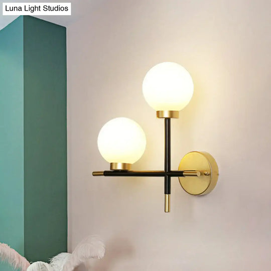 Modern Mini Globe Milk Glass Wall Sconce - 2-Light Black Fixture For Foyer