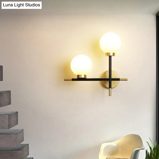 Modern Mini Globe Milk Glass Wall Sconce - 2-Light Black Fixture For Foyer