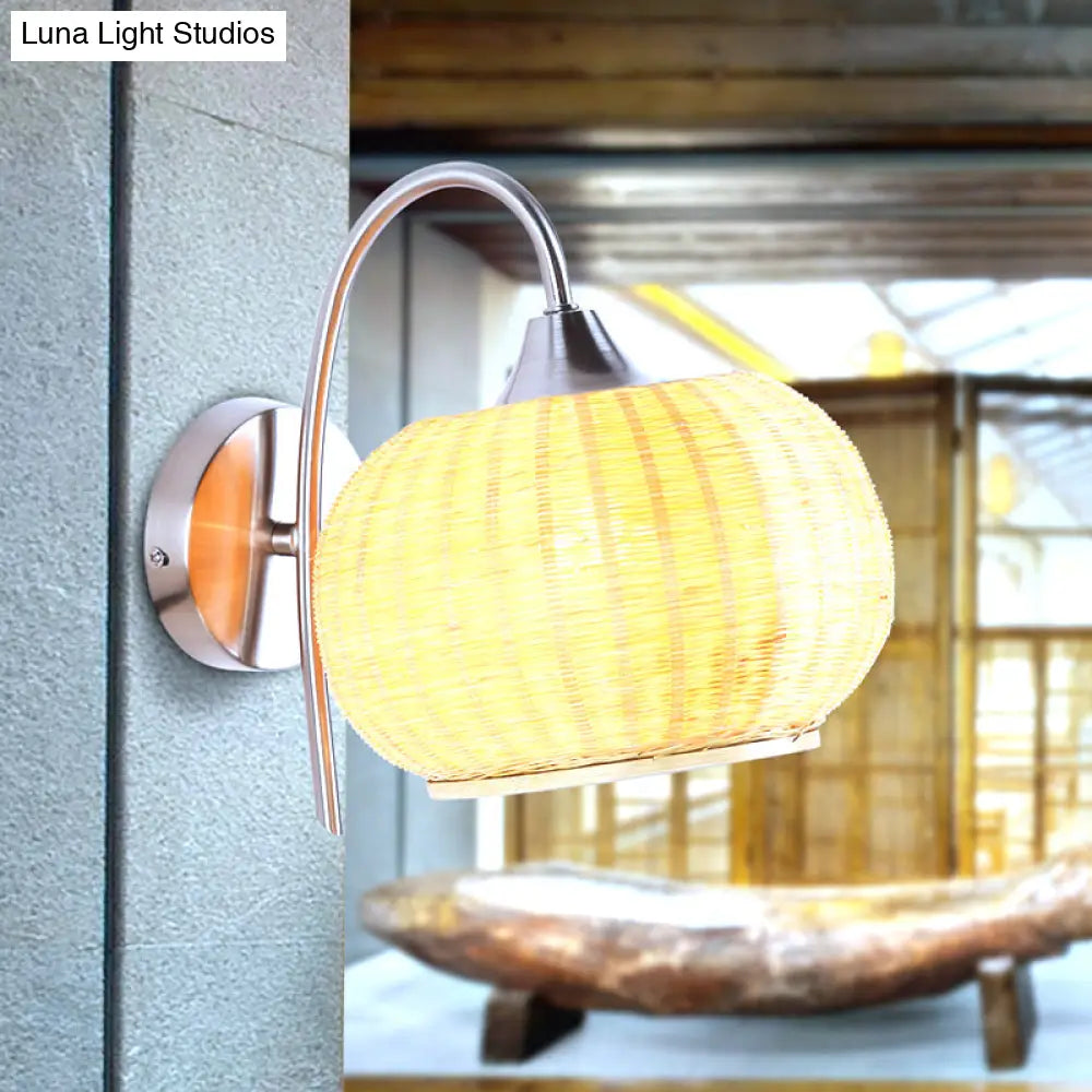 Modern Rattan Drum Sconce Wall Light - Chrome Finish 1-Light Lamp With Curved Metal Arm