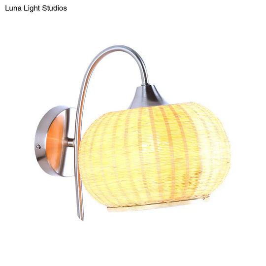 Modern Rattan Drum Sconce Wall Light - Chrome Finish 1-Light Lamp With Curved Metal Arm