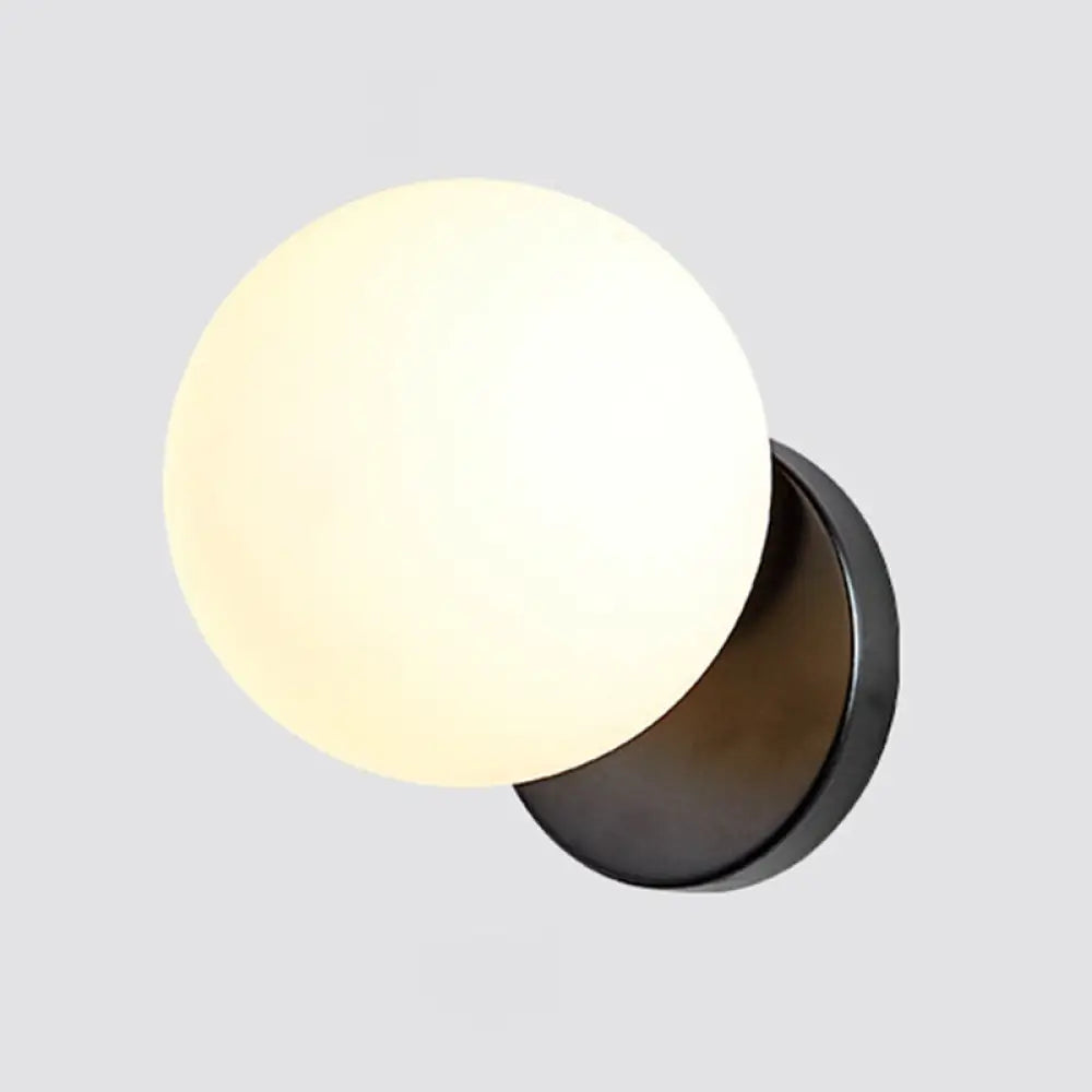 Modern Simplicity Wall Sconce: 1-Light Metal Lamp With Glass Ball Shade Black / Milk White