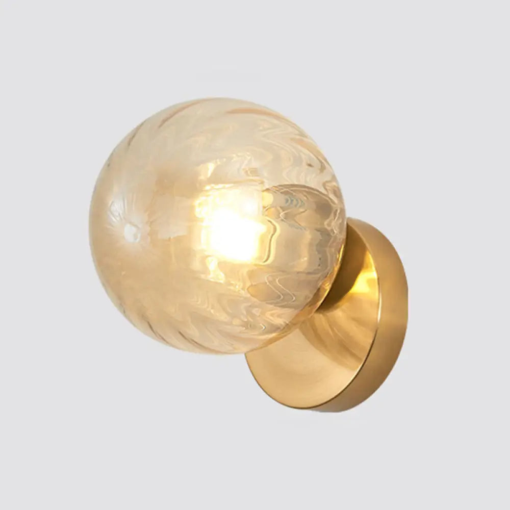 Modern Simplicity Wall Sconce: 1-Light Metal Lamp With Glass Ball Shade Gold / Amber