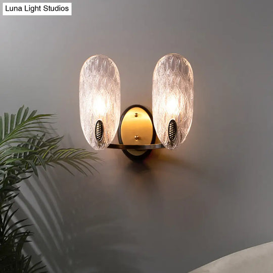 Modern Textured Glass Oval Wall Lamp 1/2-Light Fixture In Black & Gold For Corridor