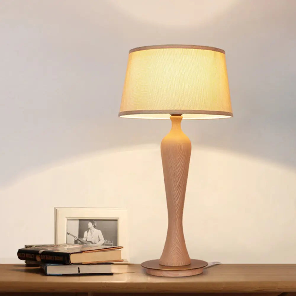 Modern Urn-Shaped Wood Desk Lamp In Beige - 1 Bulb Table Light With Drum Fabric Shade