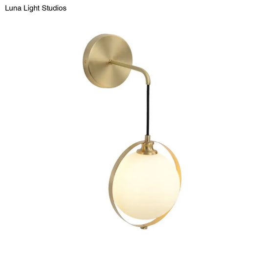 Modern White Glass Ball Sconce Light With Brass Wall Mount And Curved Arm - 1 Bulb