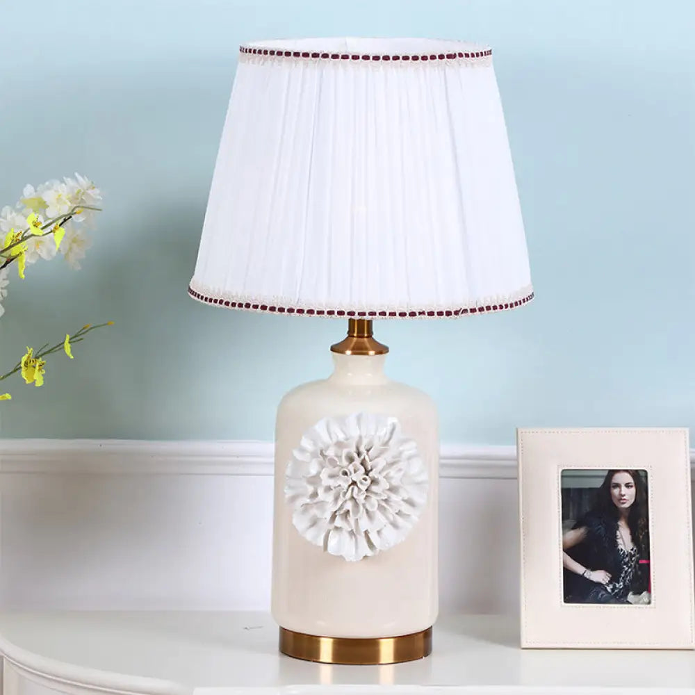 Modern White Truncated Cone Table Lamp With Pleated Fabric Shade And Flower Decor