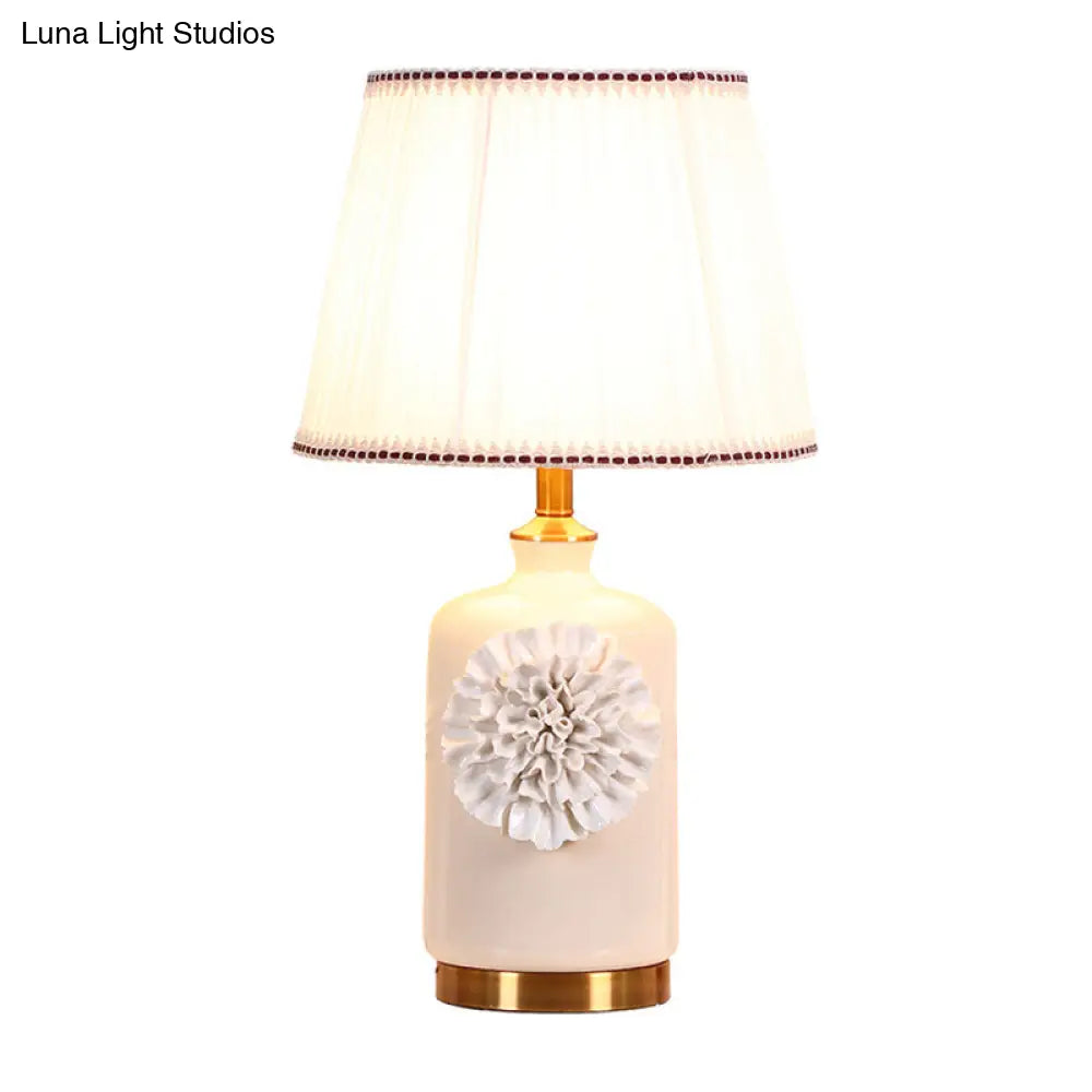 Modern White Truncated Cone Table Lamp With Pleated Fabric Shade And Flower Decor