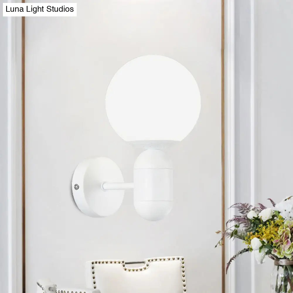 Modern White Wall Lamp With Globe Shade Capsule Body - Metal & Glass Light For Meeting Room