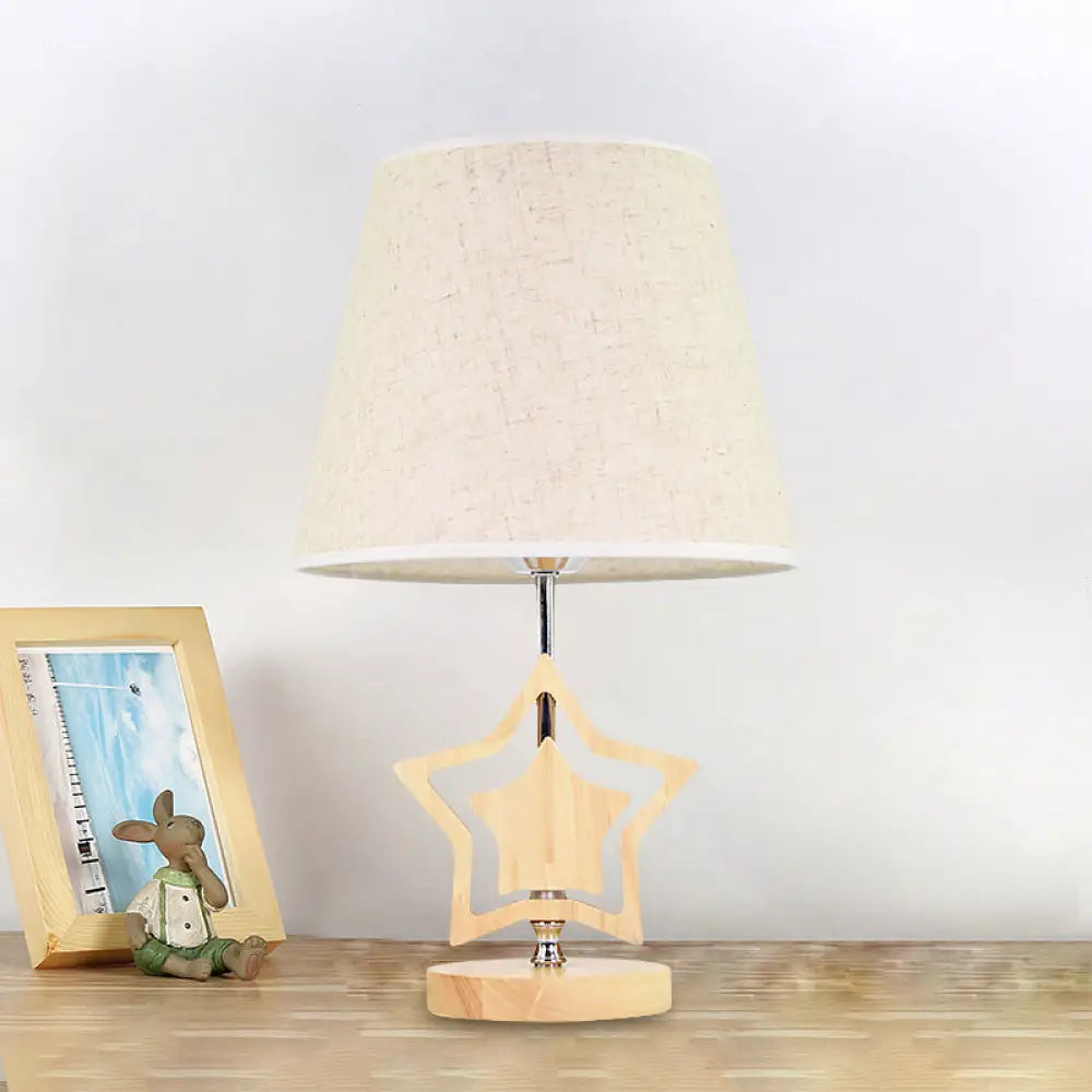 Modern Wood Star Nightstand Lamp With Beige Barrel Fabric Shade