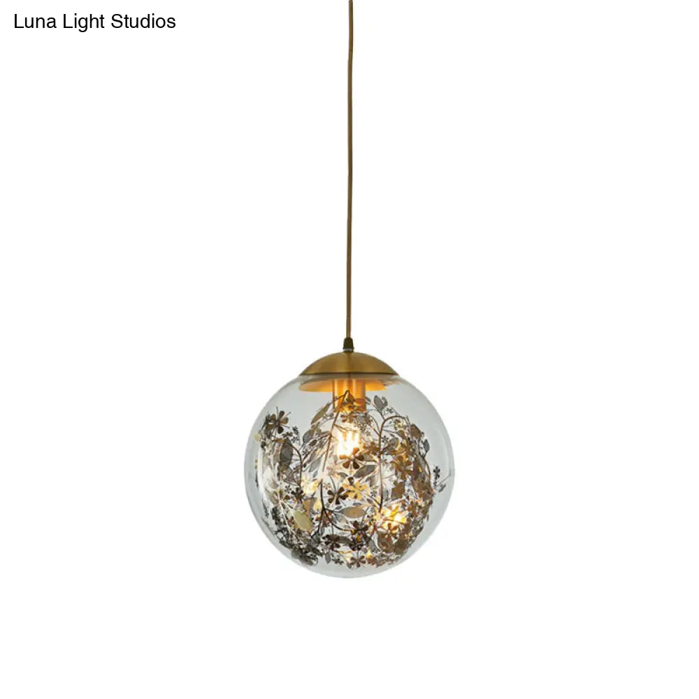 Modern Clear Glass Yellow Ball Pendant Lamp With Shattered Leaves Decoration - 1-Head Ceiling Light