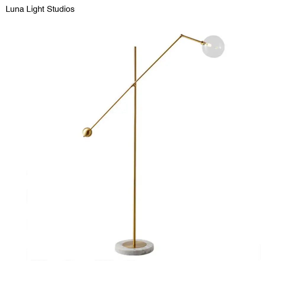 Modernist Gold Metal Balance Arm Task Floor Lamp With Orb Design Single Bulb Standing Light For