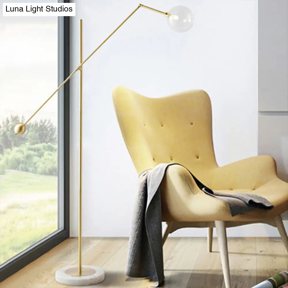 Modernist Gold Metal Balance Arm Task Floor Lamp With Orb Design Single Bulb Standing Light For