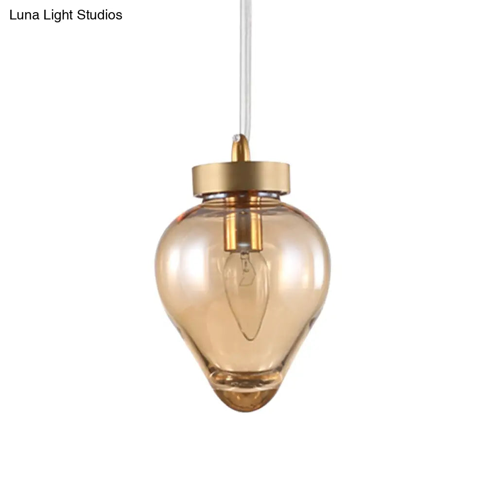 Modern Amber Glass Pendant With Gold Urn Design - Perfect For Dining Room Lighting