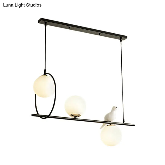 Modernist Milk Glass Pendant Lamp With 3 Globe Heads And Bird Accent - Black Finish